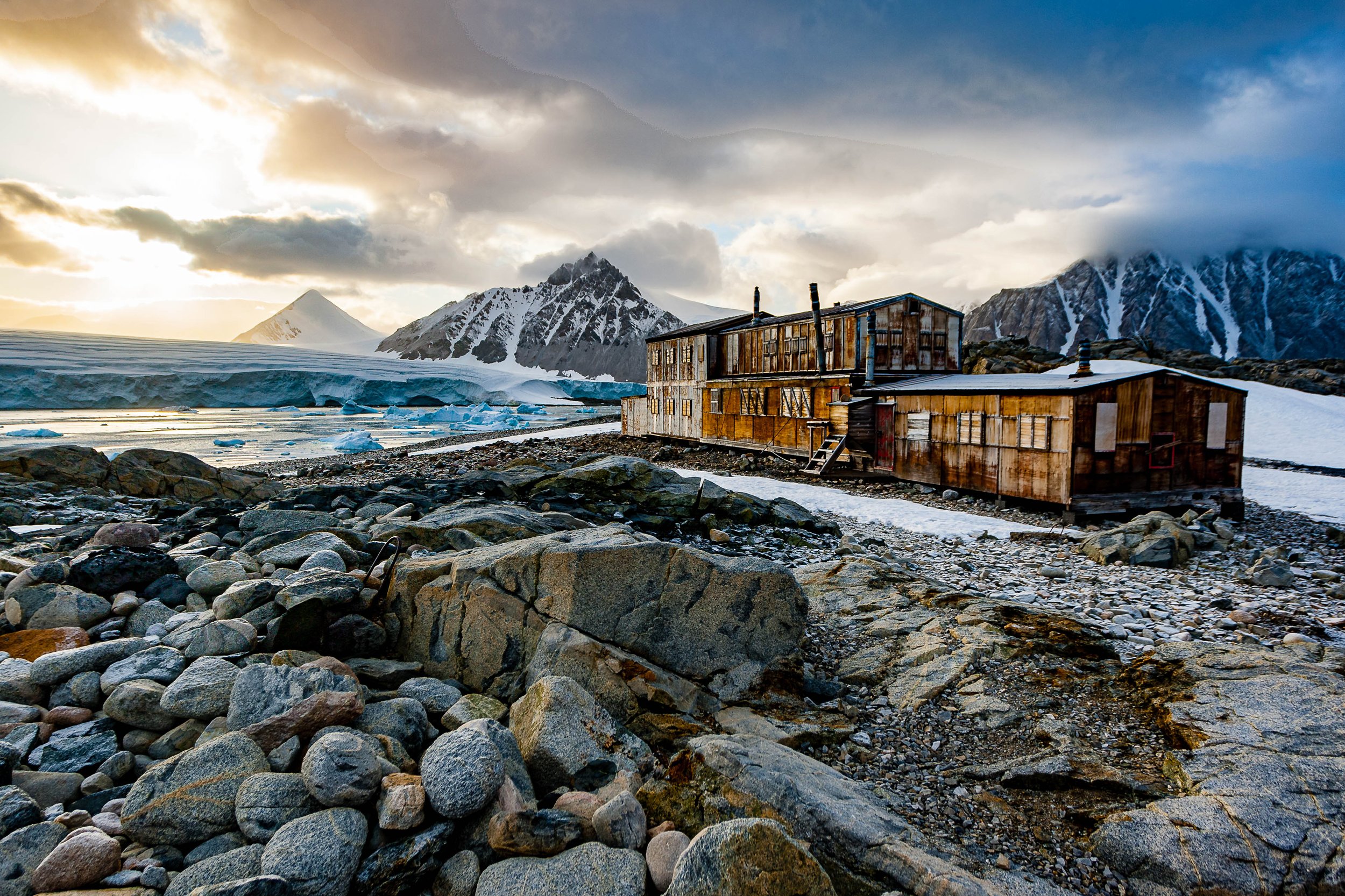 Dramatic Patagonian peaks and stormy sky above remote trails