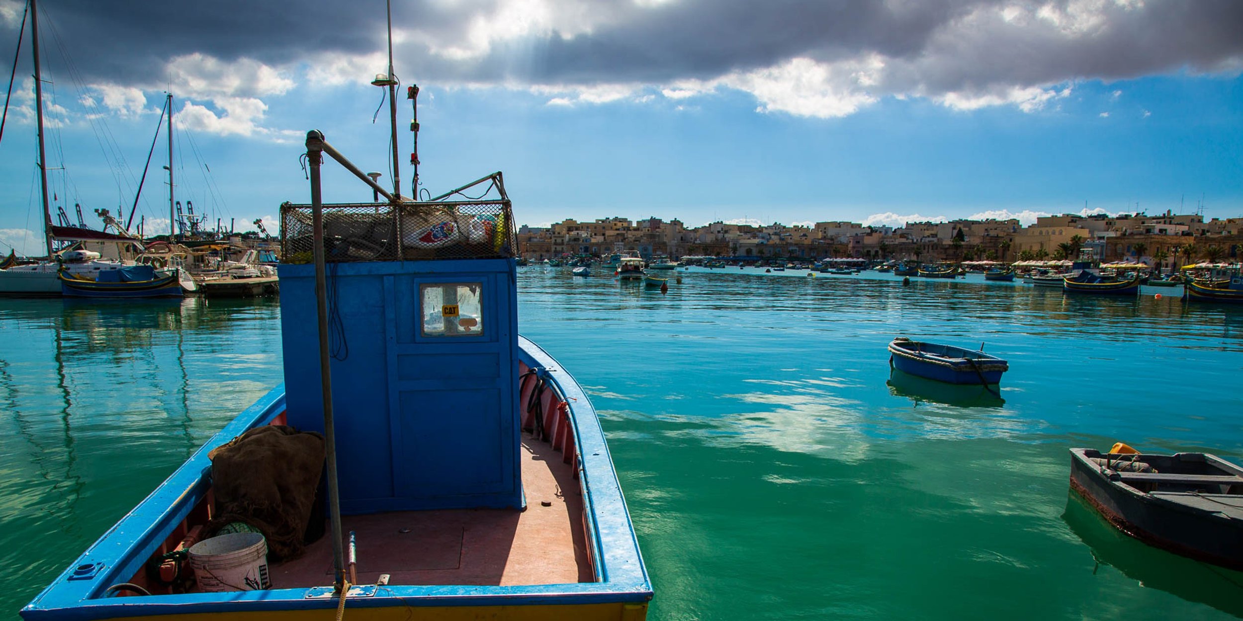 Historic coastal stone streets and calm lagoon tones